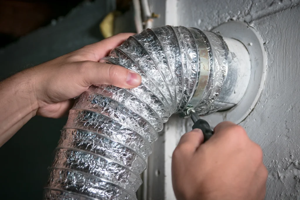 man-working-on-ducts-